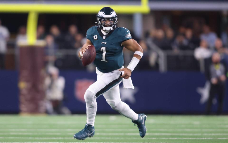 Dec 10, 2023; Arlington, Texas, USA; Philadelphia Eagles quarterback Jalen Hurts (1) rolls out in the game against the <a class="link " href="https://sports.yahoo.com/nfl/teams/dallas/" data-i13n="sec:content-canvas;subsec:anchor_text;elm:context_link" data-ylk="slk:Dallas Cowboys;sec:content-canvas;subsec:anchor_text;elm:context_link;itc:0">Dallas Cowboys</a> at AT&T Stadium. Mandatory Credit: Tim Heitman-USA TODAY Sports