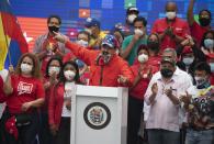 Venezuela's President Nicolas Maduro speaks to supporters during a closing campaign rally for the upcoming National Assembly elections in Caracas, Venezuela, Thursday, Dec. 3, 2020. Venezuelans will vote for a new National Assembly this Sunday, Dec 6. (AP Photo/Ariana Cubillos)