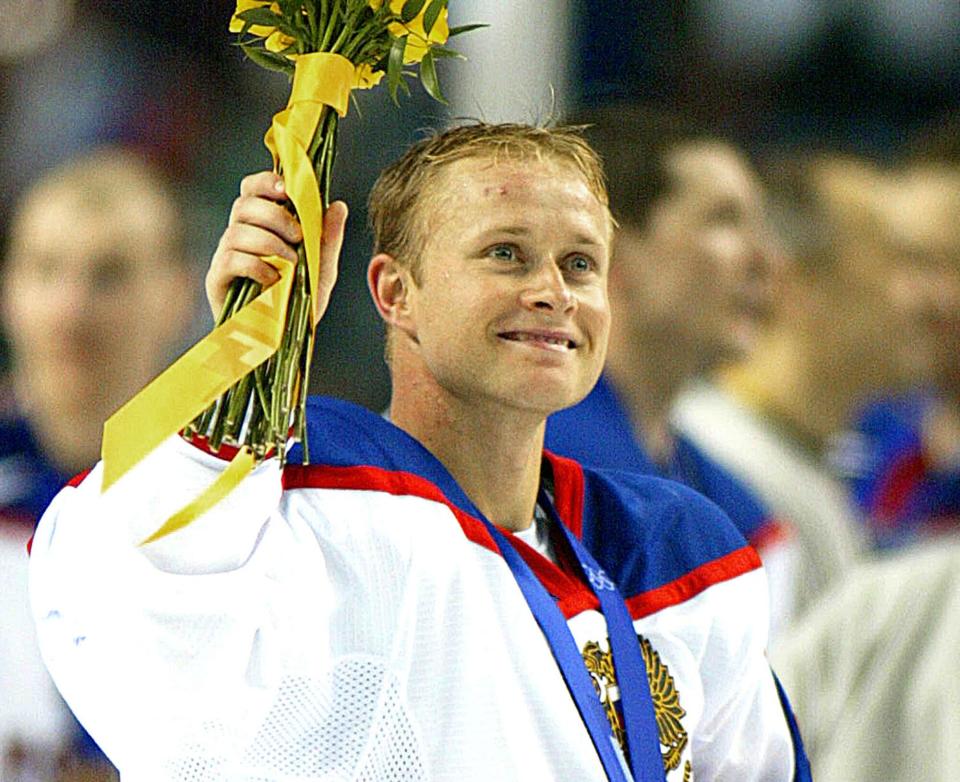 Valeri Bure celebrates his bronze medal following Russia's 7-2 victory over Belarus in the Men's Ice Hockey bronze competition of the XIX Winter Olympics 23 February 2002 in Salt Lake City, Utah