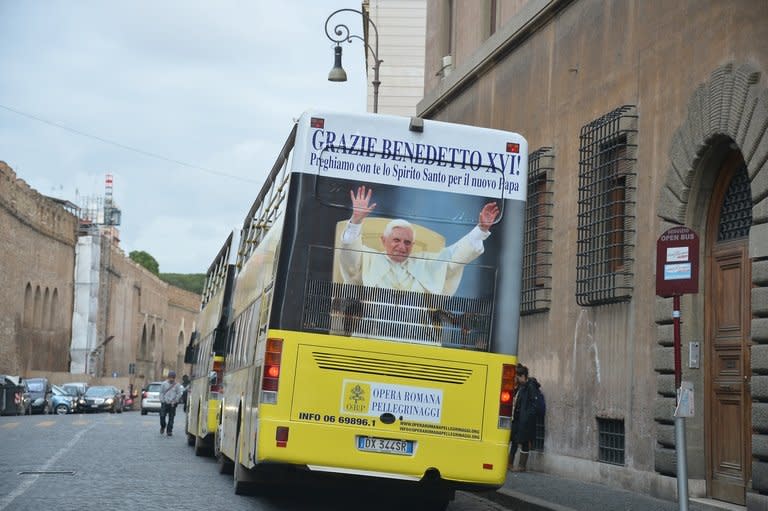 A poster reading "thanks Pope Benedict XVI" is seen on a bus on March 11, 2013 at the Vatican. The historic conclave to choose a successor for the first pope to resign in over 700 years begins on Tuesday, with the world in suspense over a secret election with no clear frontrunner