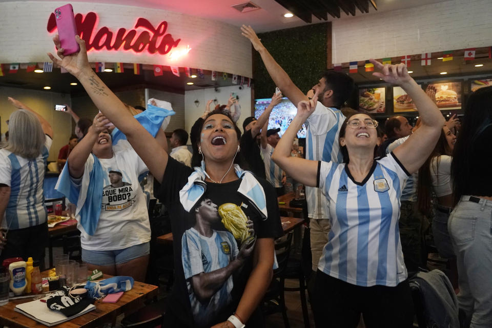 Fans celebrate at a watch party as Argentina scores a goal against Croatia Tuesday, Dec. 13, 2022, in Miami Beach, Fla. Argentina defeated Croatia 3-0 to advance to the final game. (AP Photo/Marta Lavandier, Pool)