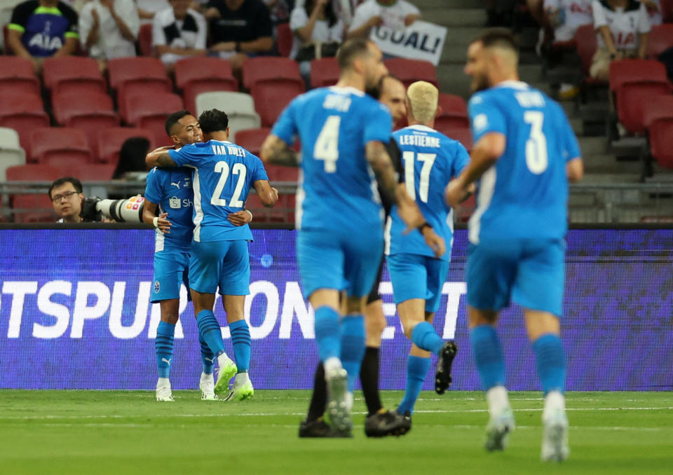 Lion City Sailors' Shawal Anuar celebrates scoring their first goal against Tottenham Hotspur with teammates during their Festival of Football friendly at National Stadium.