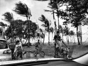 <p>A group of people bike down Ocean Drive during the middle of a rainstorm ahead of Hurricane Irma Saturday in Miami Beach, Fla. (Photo: Holly Bailey/Yahoo News) </p>