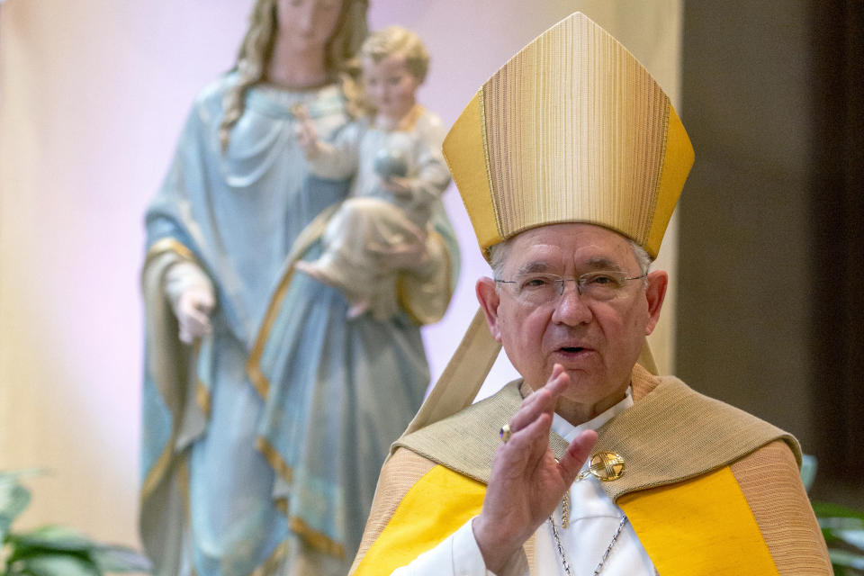 FILE - In this Friday, May 1, 2020 file photo, Archbishop Jose H. Gomez gives a blessing after leading a brief liturgy at the Cathedral of Our Lady of the Angels in Los Angeles. The nation's Catholic bishops begin their fall annual meeting Monday, Nov. 14, 2022, where they plan to elect new leaders — a vote that may signal whether they want to be more closely aligned with Pope Francis' agenda or maintain a more formal distance. (AP Photo/Damian Dovarganes, Pool)