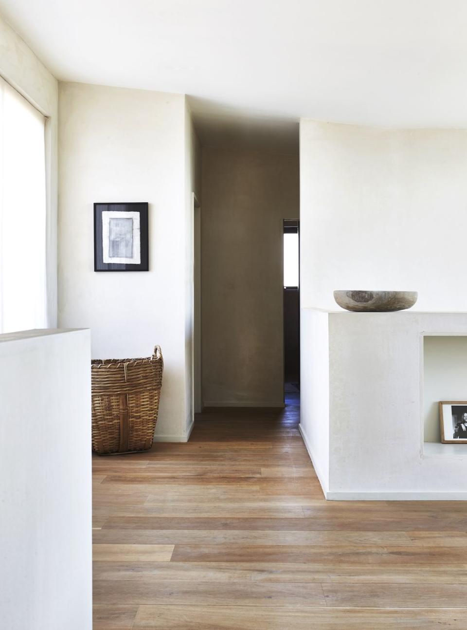 living space with parquet floor and wicker basket