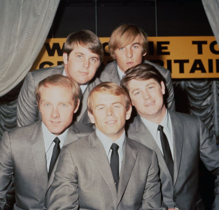 The Beach Boys are seen on Nov. 2, 1964. Top: Brian Wilson, left, and Dennis Wilson, who died in 1983. Bottom, left to right, Mike Love, Al Jardine and Carl Wilson, who died in 1998. (Credit: Hulton Archive/Getty Images)