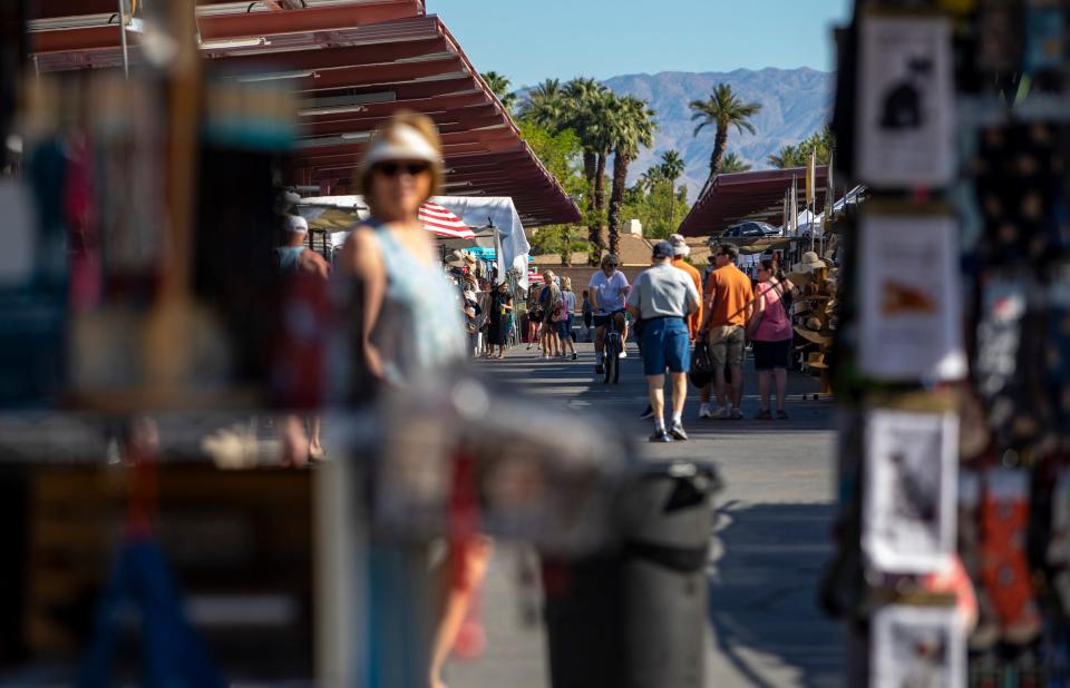 Shoppers check out an array of different vendors during The Street Fair at College of the Desert in Palm Desert, Calif., Saturday, May 11, 2024.
