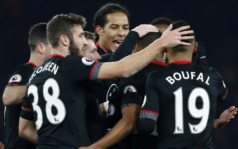 Teammates congratulate Southampton's Jordy Clasie after he scored his team's first goal against Arsenal at the Emirates Stadium in London on November 30, 2016