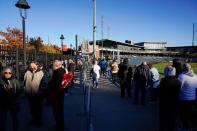 Voters wait in line during early voting at ONEOK Field in Tulsa