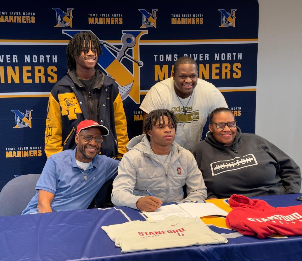 Toms River North star Micah Ford poses with his family during a signing day event celebrating his future at Stanford.