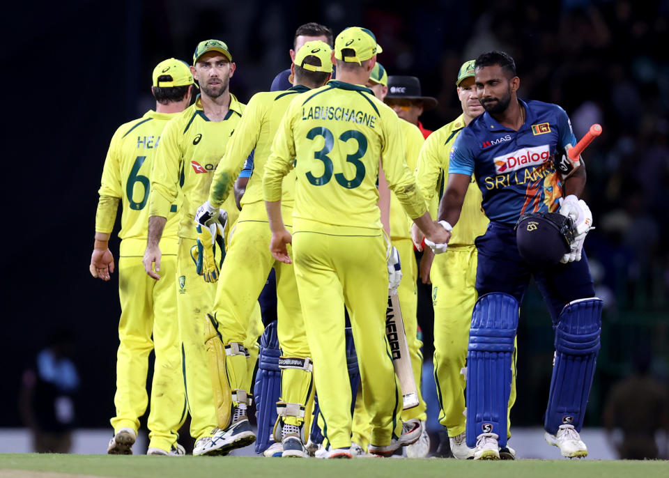 Aussie players, pictured here congratulating Chamika Karunaratne after the third ODI against Sri Lanka.