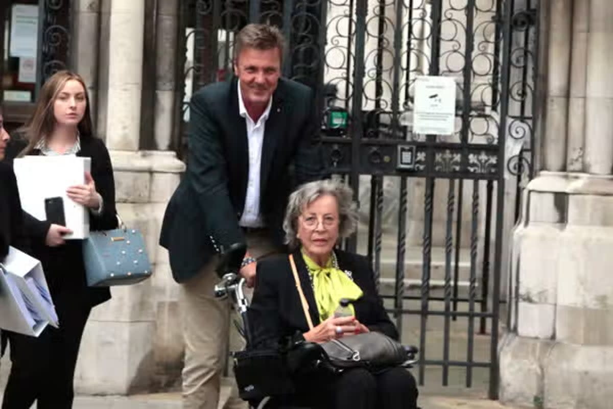 Hanelore Matt (in wheelchair) and her son Andreas Matt outside Central London County Court (Champion News)