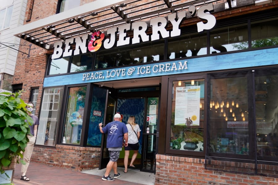 FILE – Two patrons enter a Ben & Jerry’s Ice Cream shop, Tuesday, July 20, 2021, in Burlington, Vt. (AP Photo/Charles Krupa, File)