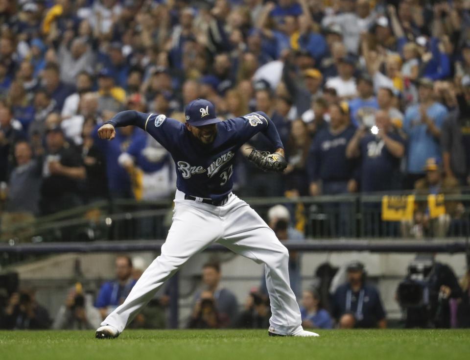 Milwaukee Brewers' Jeremy Jeffress reacts after getting Colorado Rockies' Ryan McMahon to ground out and end the ninth inning of Game 2 of the National League Divisional Series baseball game Friday, Oct. 5, 2018, in Milwaukee.The Brewersb won 4-0 to take a 2-0 lead in the series. (AP Photo/Jeff Roberson)