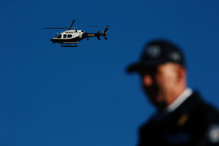 NYPD officers stand guard as runners arrive to compete in the 2016 New York City Marathon in the Manhattan borough of New York City, U.S., November 6, 2016. REUTERS/Eduardo Munoz