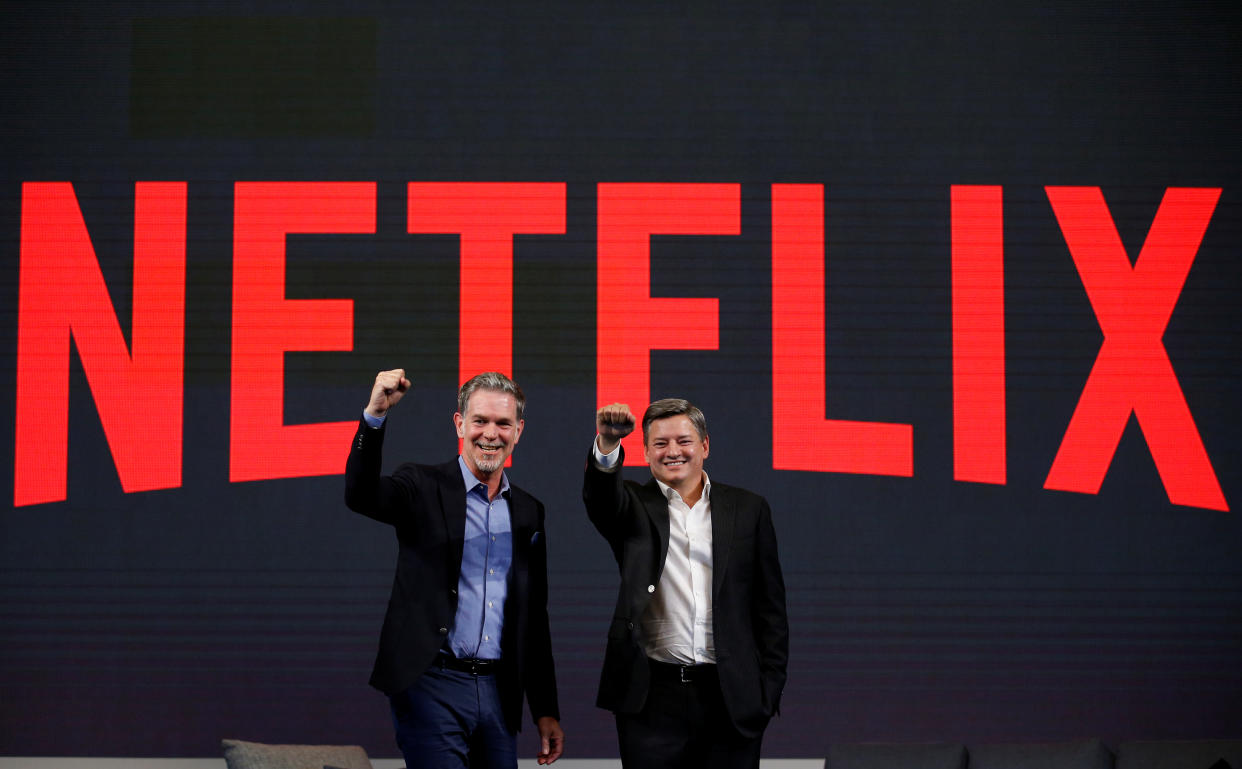 Reed Hastings (L), co-founder and CEO of Netflix, and Ted Sarandos, Netflix chief content officer, pose for photographs during a news conference in Seoul, South Korea, June 30, 2016.  REUTERS/Kim Hong-Ji