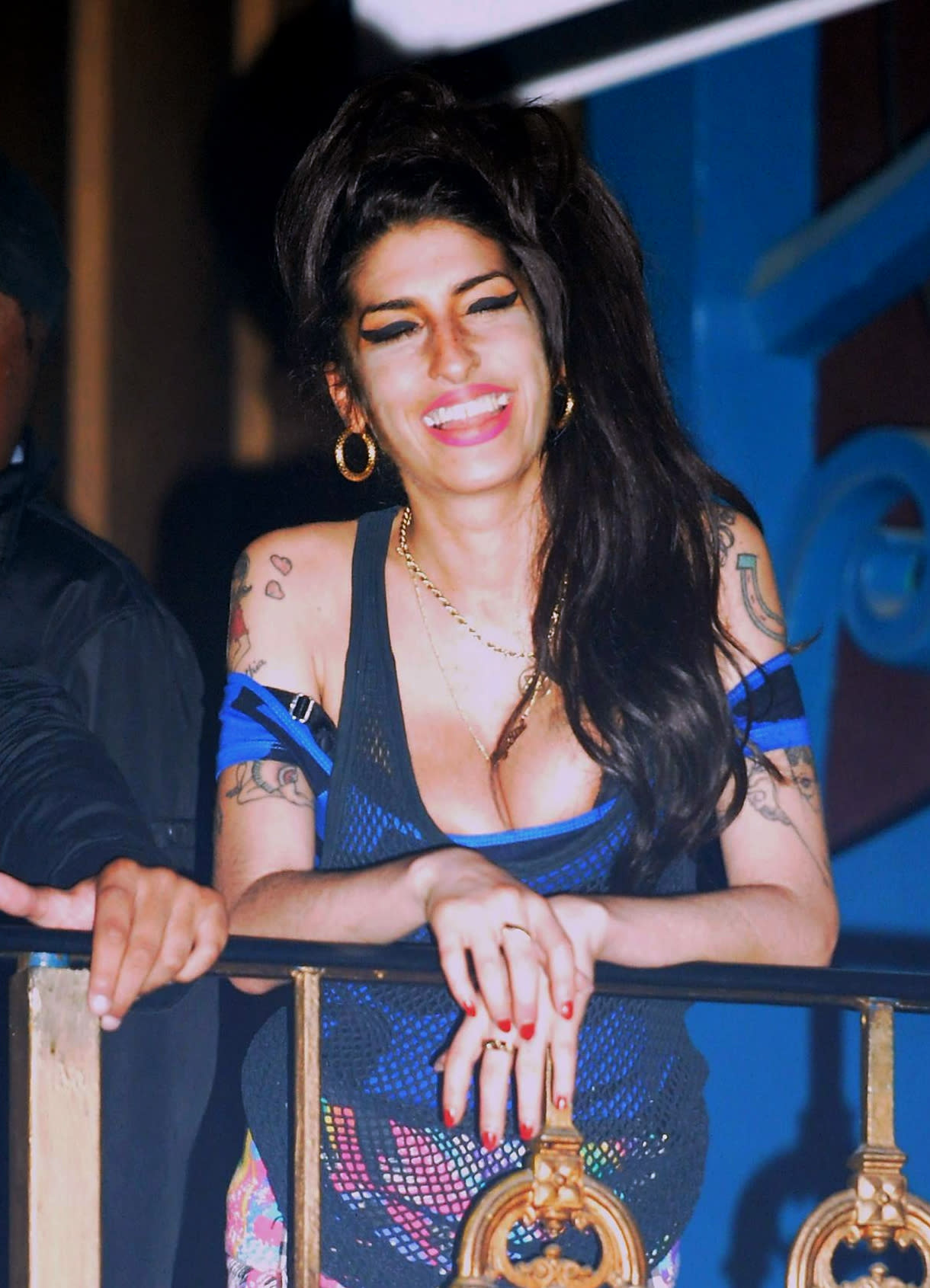 Amy Winehouse watches the Libertines perform on stage at the Forum in Highgate, London.