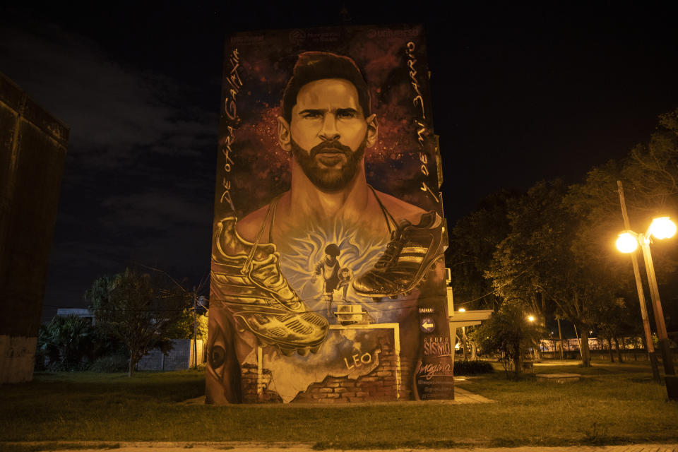 A mural of soccer star Lionel Messi decorates a building near his childhood home in Rosario, Argentina, Sunday, Dec. 5, 2021. Rosario is best known as a major agricultural port, the birthplace of revolutionary leader Ernesto “Che” Guevara and a talent factory for soccer players, including Lionel Messi. (AP Photo/Rodrigo Abd)