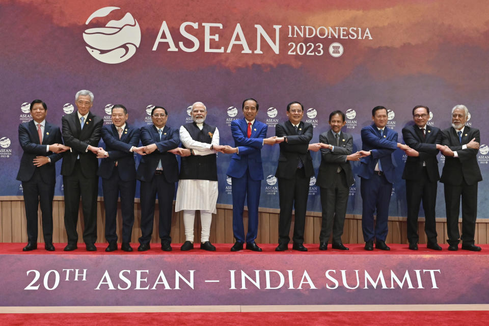 From left to right, Philippine's President Ferdinand Marcos, Jr., Singapore's Prime Minister Lee Hsien Loong, Thailand's Permanent Secretary of the Ministry of Foreign Affairs Sarun Charoensuwan, Vietnam's Prime Minister Pham Minh Chinh, Indian Prime Minister Narendra Modi, Indonesian President Joko Widodo, Laos' Prime Minister Sonexay Siphandone, Brunei's Sultan Hassanal Bolkiah, Cambodia's Prime Minister Hun Manet, Malaysian Prime Minister Anwar Ibrahim and East Timor's Prime Minister Xanana Gusmao pose for a family photo during the Association of the Southeast Asian Nations (ASEAN)-India Summit in Jakarta, Indonesia, Thursday, Sept. 7, 2023. (Adek Berry/Pool Photo via AP)