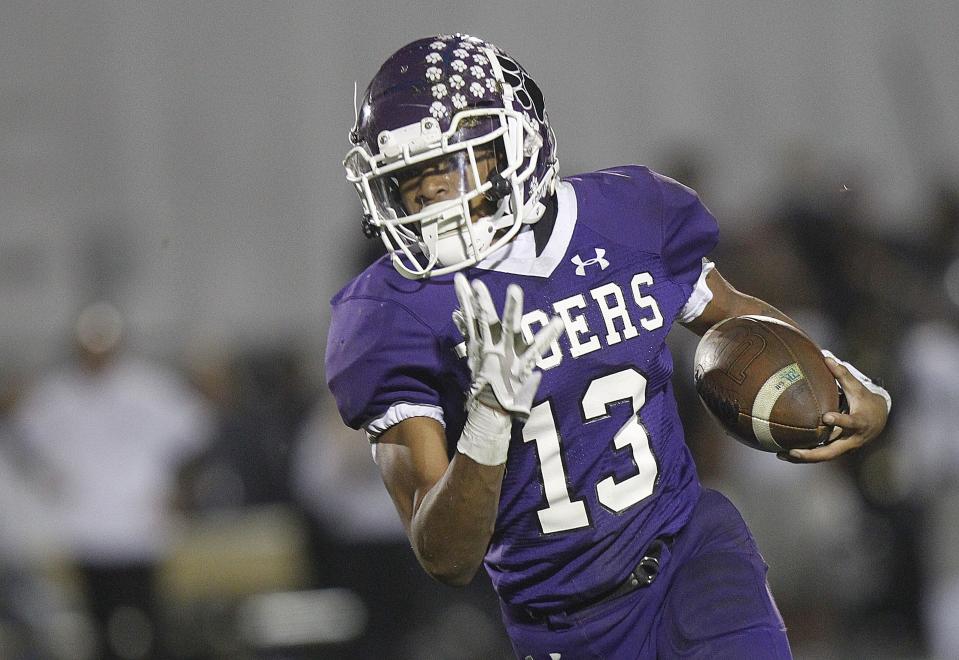 Pickerington Central's Terrance Alexander runs for a first down to seal the Tigers' 28-20 win over Pickerington North in a Division I regional quarterfinal Nov. 4.