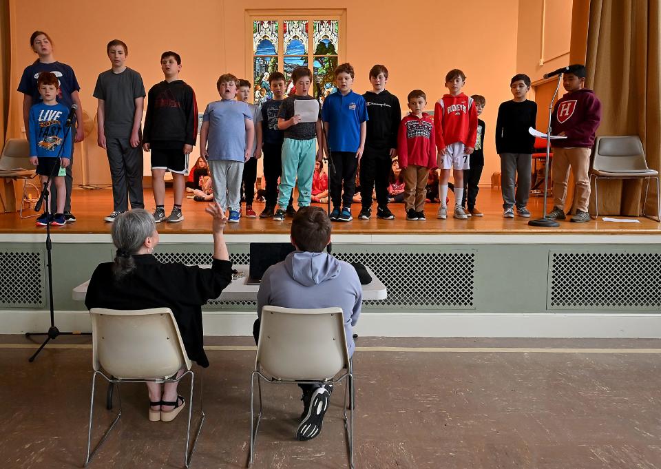 Dance director Jo Ann Warren offers advice during rehearsal for an upcoming performance at the T.E.C. Schools at Trinity Lutheran Church in Worcester.