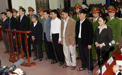 Pham Thanh Binh (3rd L, front line), the former chairman and other top executives of Vinashin, a Vietnamese shipbuilder group whose huge debts shook investor confidence in the communist nation, stand trial in the northern coastal city of Haiphong, on March 27