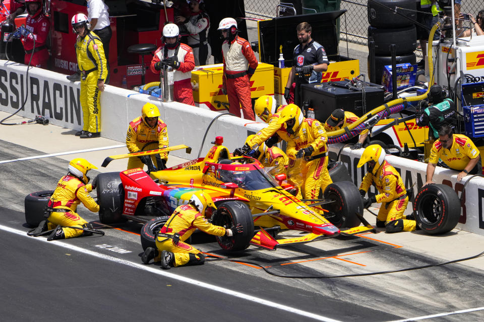 Romain Grosjean, of France, makes a pit stop during the Indianapolis 500 auto race at Indianapolis Motor Speedway in Indianapolis, Sunday, May 29, 2022. (AP Photo/AJ Mast)