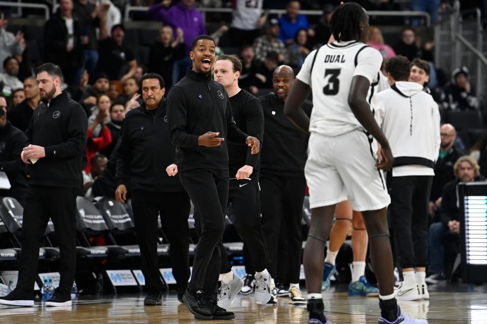 Providence head coach Kim English coaches his players from the sideline Tuesday night.