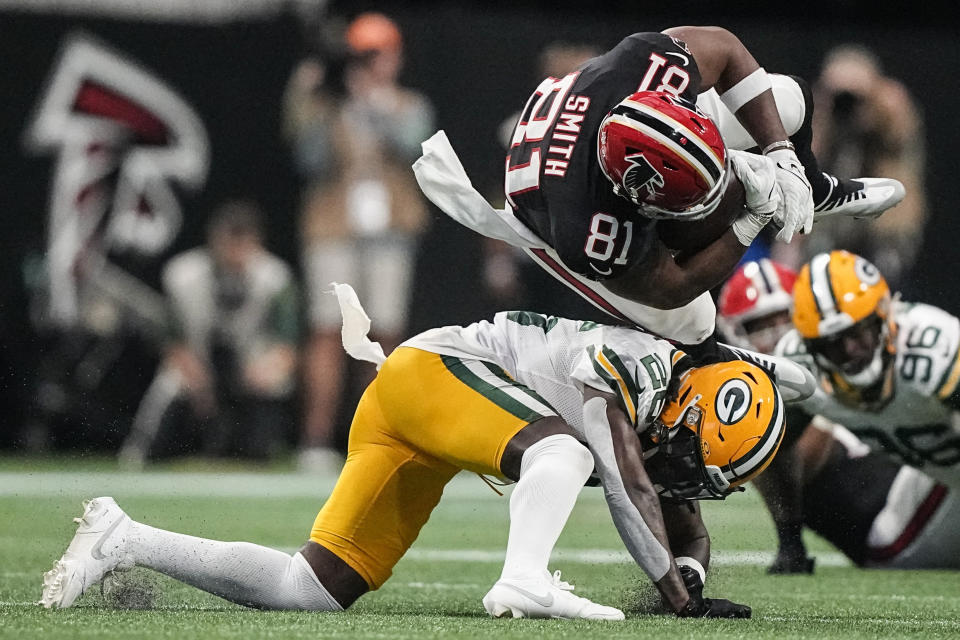 Green Bay Packers safety Darnell Savage (26) hits Atlanta Falcons tight end Jonnu Smith (81) during the second half of an NFL football game, Sunday, Sept. 17, 2023, in Atlanta. (AP Photo/Brynn Anderson)