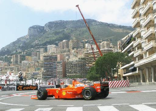 Germany's Michael Schumacher steers his Ferrari out of the tunnel with Monaco in the background during the second timed practice session of the Monaco Grand Prix Thursday, May 21, 1998. Schumacher clocked the fifth fastest time.(AP Photo/Michel Euler)