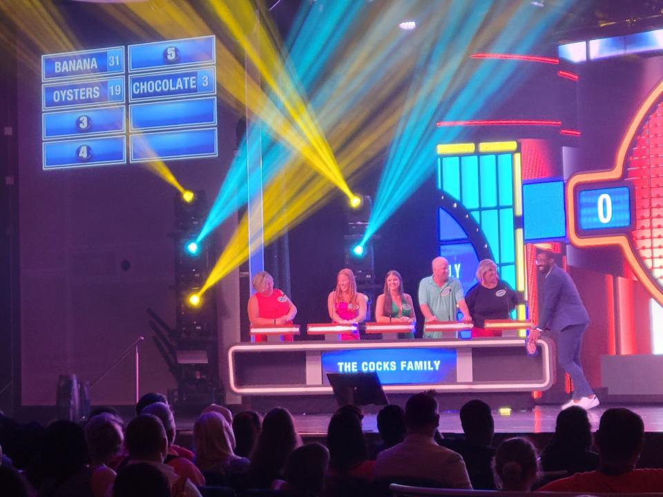 family playing family feud on a carnival cruise ship
