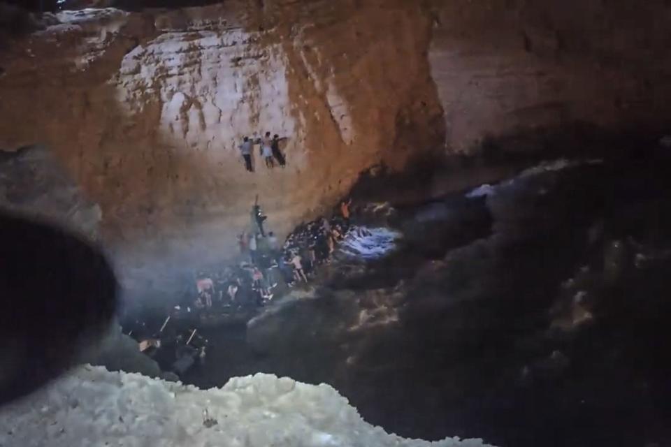 This screen grab from a video made available on Oct. 6, 2022 by the Hellenic Coast Guard, shows the rescue of migrants from a shipwreck off the island of Cythera, south of the Peloponnese peninsula. There was no official toll yet from a second sinking south of the peninsula.