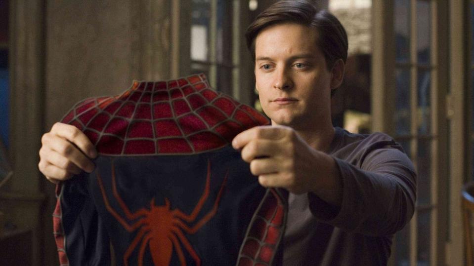 Tobey Maguire's Peter Parker holds up his suit to look at it. Could Tobey Maguire's Spider-Man be in No Way Home via multiverse?