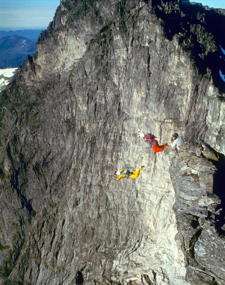 <span class="article__caption">Jean (in yellow) and Carl on her heels as they exit the launch site during their world-record jump.</span> (Photo: Fred Husoy)