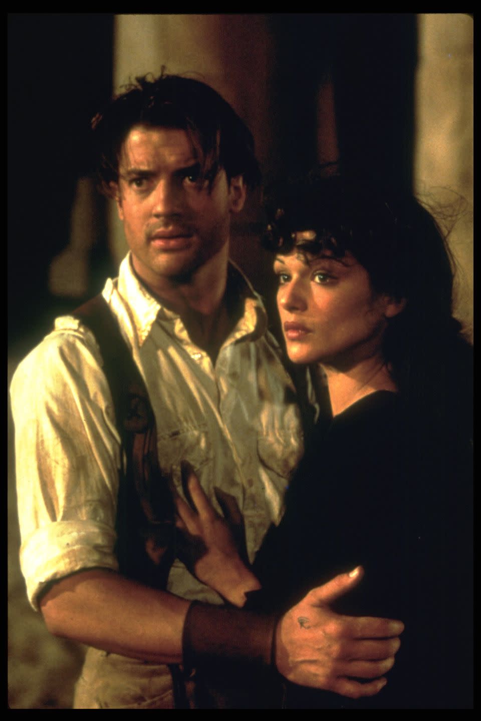 brendan fraser embracing costar rachel weisz during a scene from the mummy