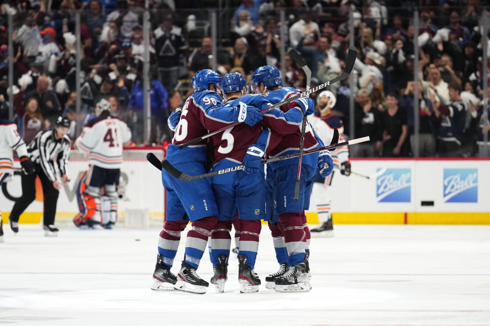 Colorado Avalanche palyers celebrate a goal against the Edmonton Oilers during the second period in Game 2 of the NHL hockey Stanley Cup playoffs Western Conference finals Thursday, June 2, 2022, in Denver. (AP Photo/Jack Dempsey)