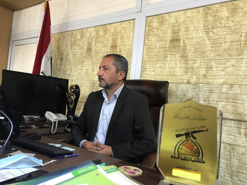 Mohammed Mohi, spokesman for Kataib Hezbollah paramilitary group attends an interview with Reuters in Baghdad