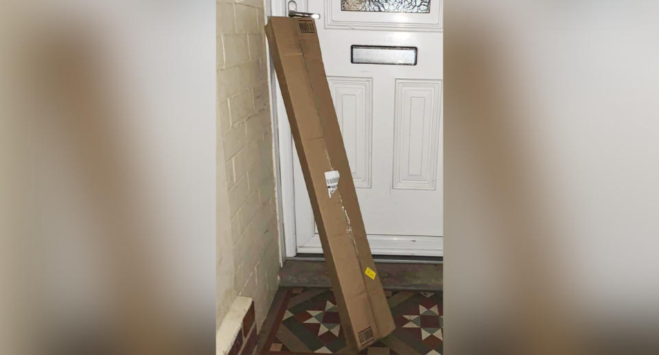 The woman's delivery was lodged underneath her door handle. Source: Facebook