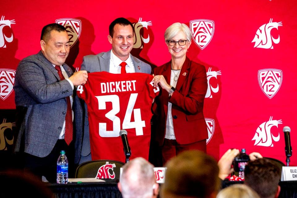 Washington State football coach Jake Dickert stands with Washington State athletic director Pat Chun, left, and Washington State Provost Elizabeth Chilton on Thursday, Dec. 2, 2021, in Pullman.