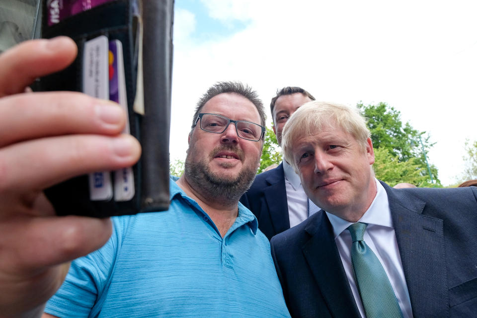 Conservative party leadership candidate Boris Johnson poses for a selfie with a steelworker during a visit to Guisborough, North Yorkshire.