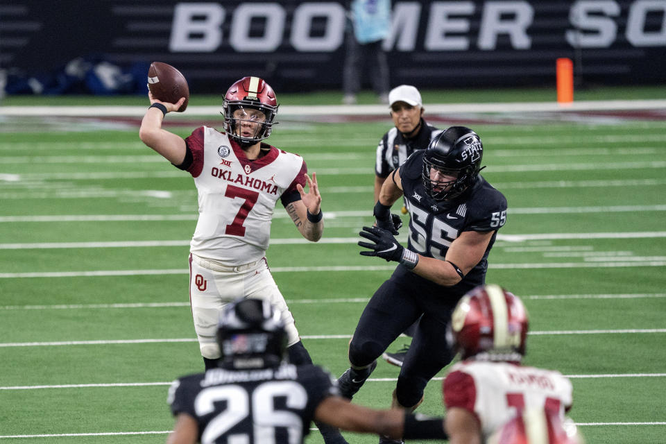 Oklahoma quarterback Spencer Rattler (7) throws against Iowa State during the first half of the the Big 12 Conference championship NCAA college football game, Saturday, Dec. 19, 2020, in Arlington, Texas. (AP Photo/Jeffrey McWhorter)