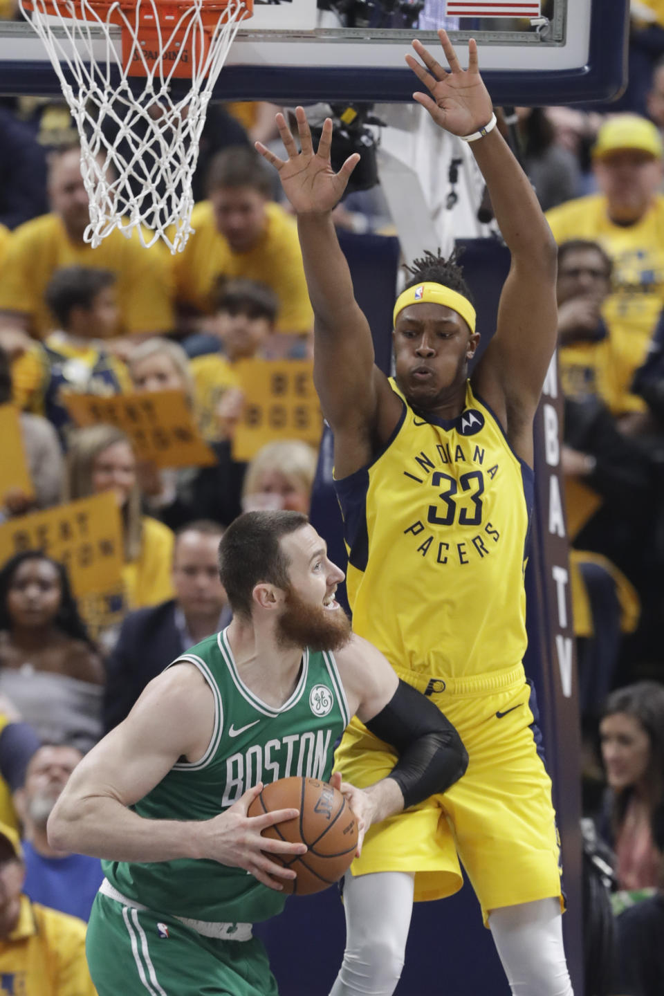 Boston Celtics center Aron Baynes (46) looks to shoot over Indiana Pacers center Myles Turner (33) during the first half of Game 3 of an NBA basketball first-round playoff series Friday, April 19, 2019, in Indianapolis. (AP Photo/Darron Cummings)