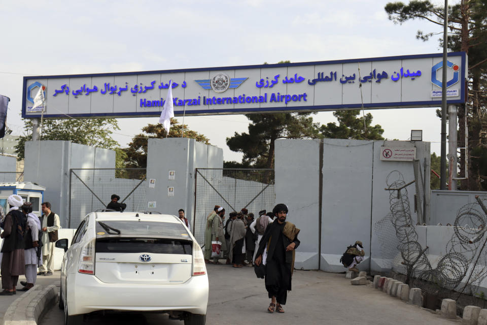 Taliban fighters stand guard in front of the Hamid Karzai International Airport after the U.S. withdrawal in Kabul, Afghanistan, Tuesday, Aug. 31, 2021. The Taliban were in full control of Kabul's international airport on Tuesday, after the last U.S. plane left its runway, marking the end of America's longest war. (AP Photo/Khwaja Tawfiq Sediqi)