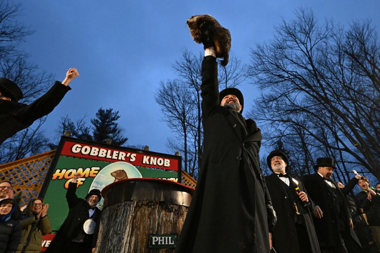 Groundhog Club handler A.J. Dereume holds Punxsutawney Phil, the weather prognosticating groundhog, during the 138th celebration of Groundhog Day on Gobbler's Knob in Punxsutawney, Pa., Friday, Feb. 2, 2024. Phil's handlers said that the groundhog has forecast an early spring.