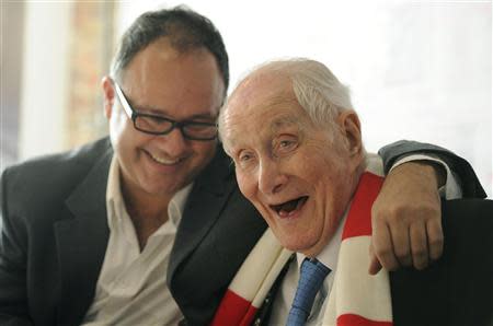 File photograph shows Great Train Robber Ronnie Biggs (R) joking with his son Michael during a news conference to launch his an updated version of his autobiography in London November 17, 2011. REUTERS/Paul Hackett/Files