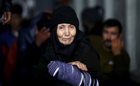 A refugee sits on board of Turkish Coast Guard Search and Rescue ship Umut-703 after a failed attempt of crossing to the Greek island of Lesbos off the shores of Canakkale, Turkey, November 8, 2015. REUTERS/Umit Bektas