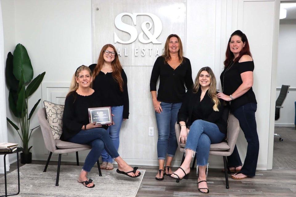 From left, Dee McDonough, Skylin Krutzky, Jennifer Ketchum, Amanda Vega and Kristina Palm of S&D Real Estate.