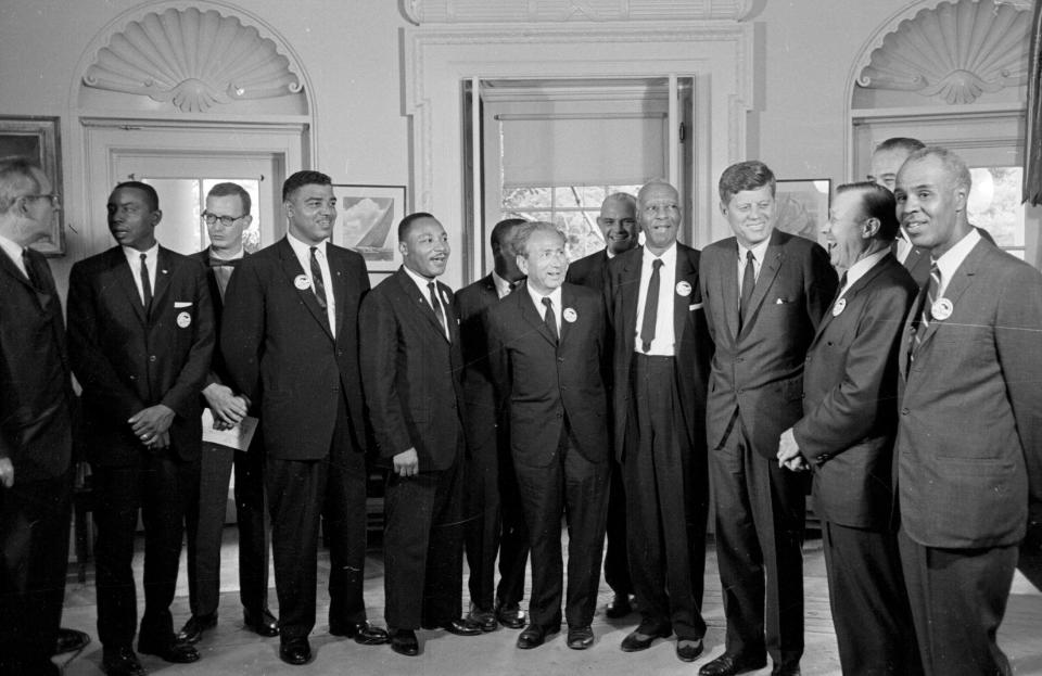 In this Aug. 28, 1963, photo, President John F. Kennedy stands with a group of leaders of the March on Washington at the White House. From left are Whitney Young, National Urban League; Martin Luther King Jr., Southern Christian Leadership Conference; John Lewis, Student Non-violent Coordinating Committee; Rabbi Joachim Prinz, American Jewish Congress; Eugene P. Donnaly, National Council of Churches; A. Philip Randolph, AFL-CIO vice president; Kennedy; Walter Reuther, United Auto Workers; Vice-President Johnson, rear, and Roy Wilkins, NAACP.
(Credit: AP)