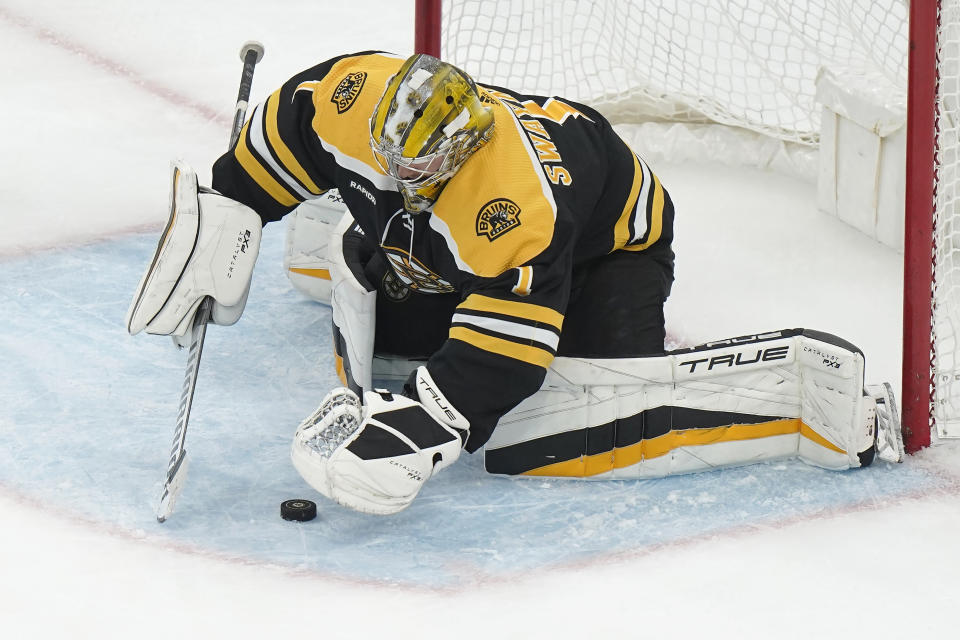 Boston Bruins goaltender Jeremy Swayman (1) stops a shot on goal during the second period of an NHL hockey game against the Montreal Canadiens, Thursday, March 23, 2023, in Boston. (AP Photo/Steven Senne)