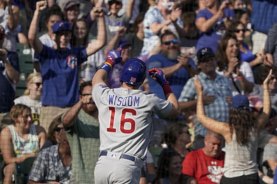 Chicago Cubs' Patrick Wisdom celebrates after hitting a three-run home run during the eighth inning of a baseball game against the Milwaukee Brewers Sunday, Sept. 19, 2021, in Milwaukee. (AP Photo/Morry Gash)